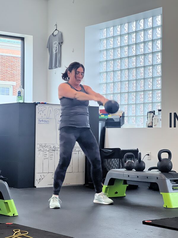 A member training with a kettlebell